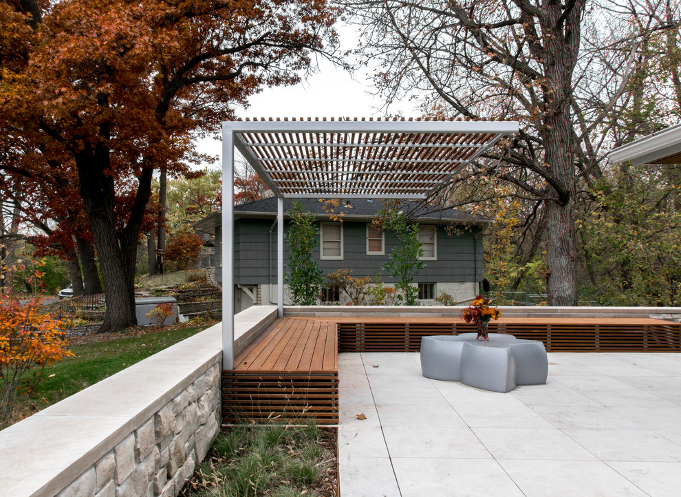Design ideas for a large modern front patio in Minneapolis with concrete paving and a gazebo.