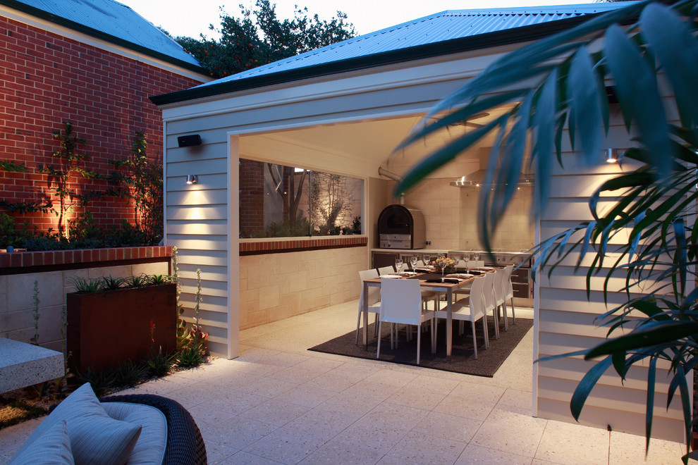 This is an example of a medium sized contemporary patio in Perth with a fire feature.