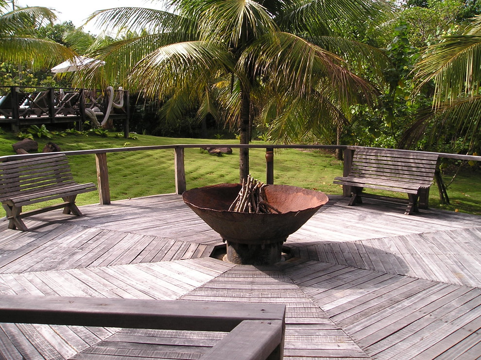 Design ideas for a large rustic back patio in Hawaii with a fire feature and decking.