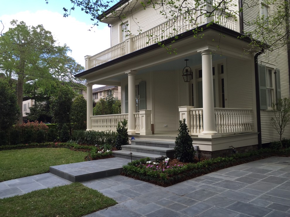 Design ideas for a medium sized traditional front patio in New Orleans with natural stone paving and no cover.