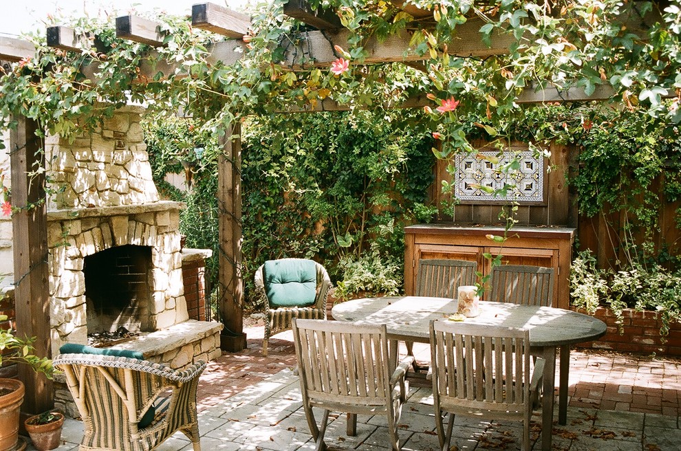 Patio - rustic patio idea in San Francisco with a fire pit and a pergola