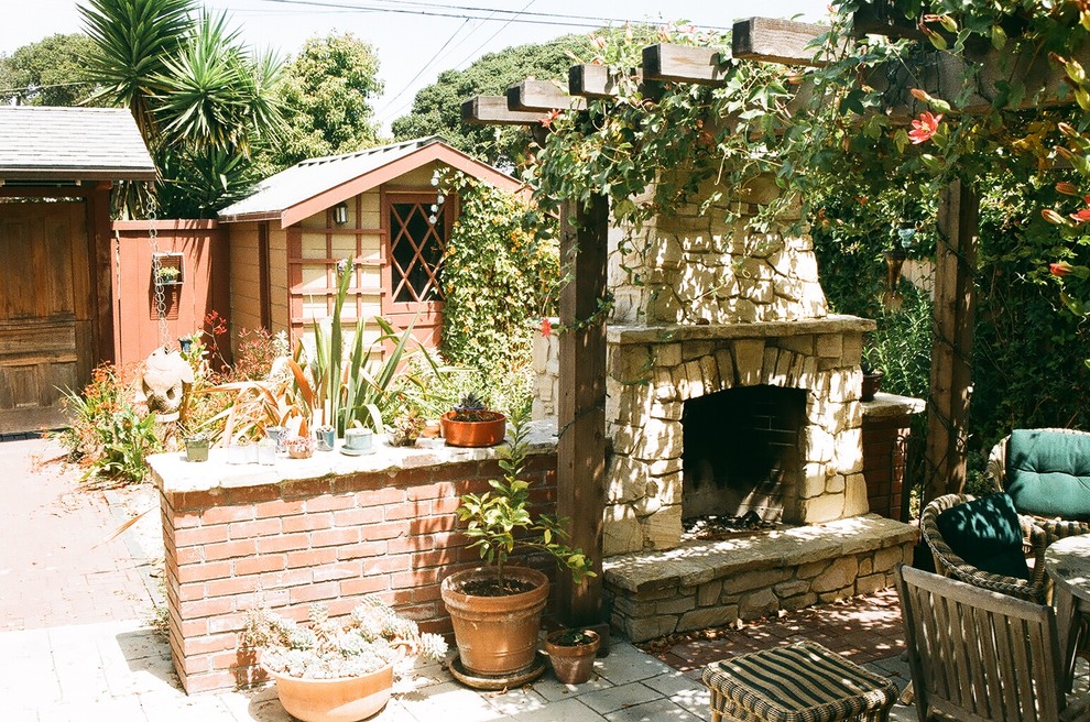 Design ideas for a rustic patio in San Francisco with a fire feature and a pergola.