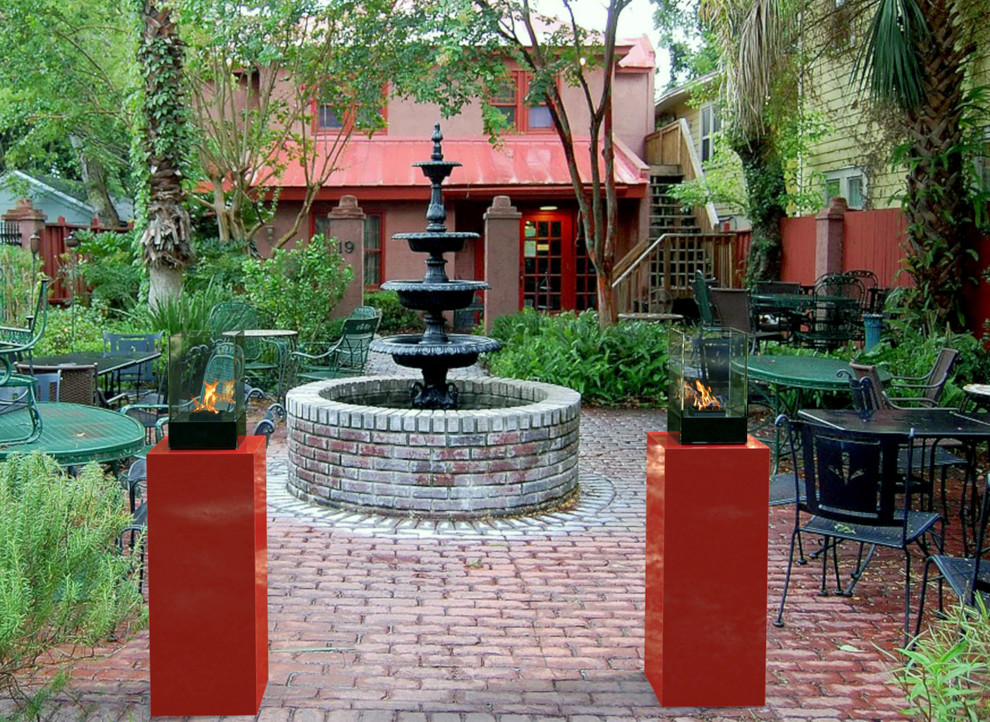 Inspiration for a large timeless courtyard stone patio remodel in Toronto with a fire pit and no cover