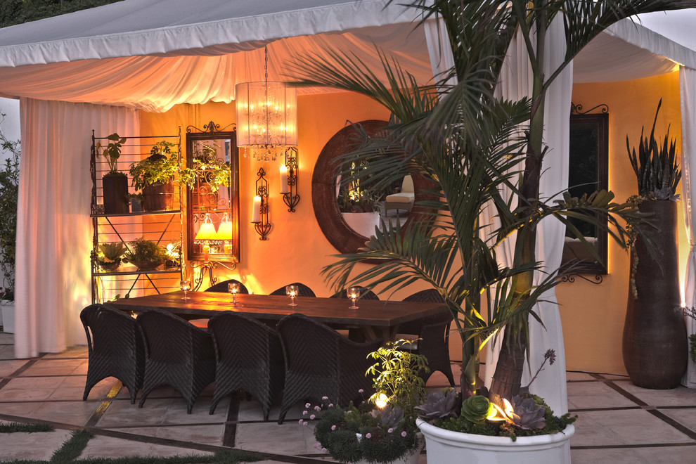 Example of an eclectic patio design in San Diego with a gazebo
