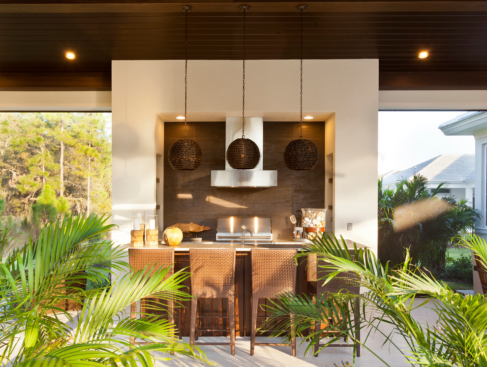 Island style patio kitchen photo in Tampa