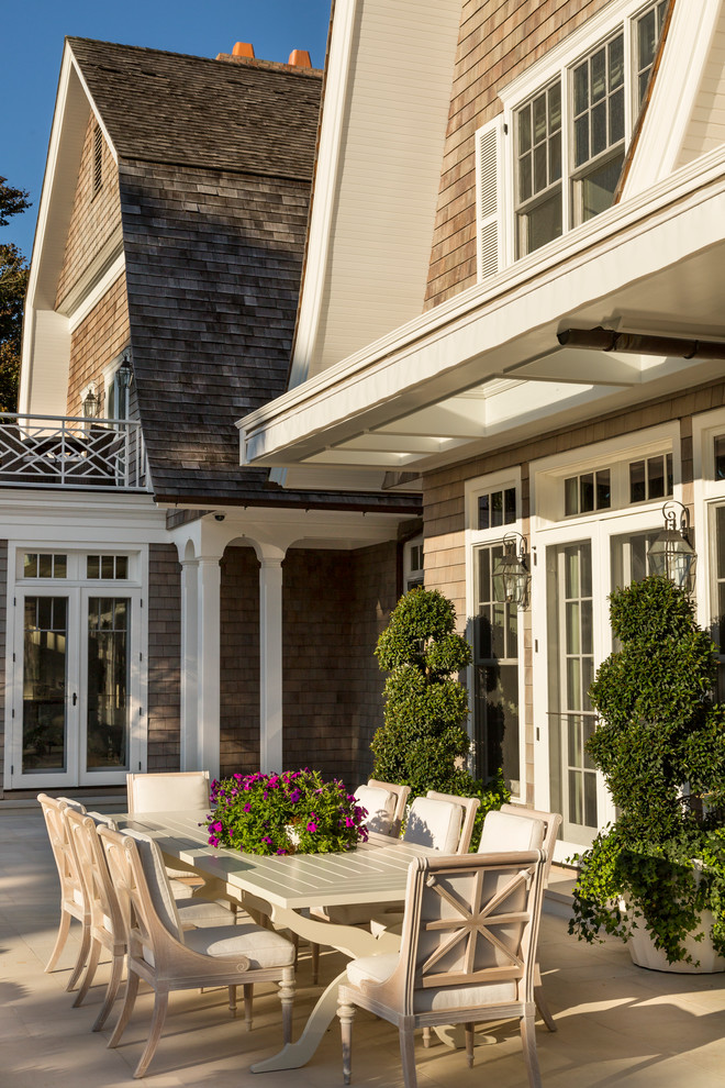 Design ideas for an expansive victorian back patio in New York with natural stone paving.