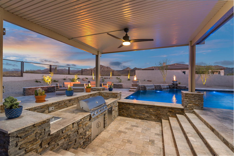 Large contemporary back patio in Phoenix with a fireplace and tiled flooring.