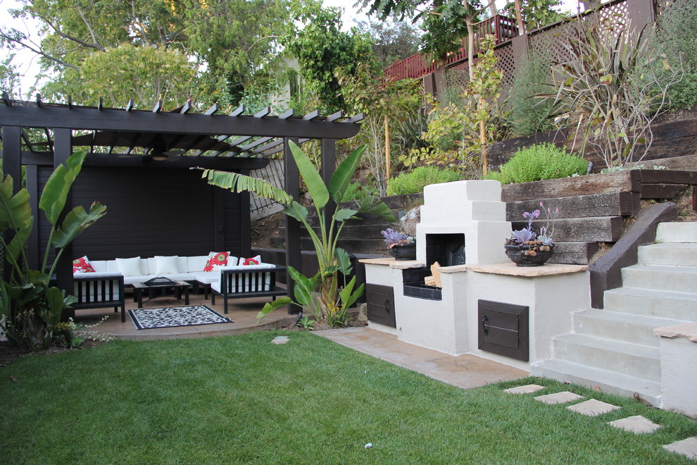 Inspiration for a traditional patio in Los Angeles with a fire feature and a pergola.