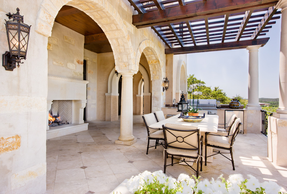 Mediterranean patio in Austin with a pergola and a bbq area.