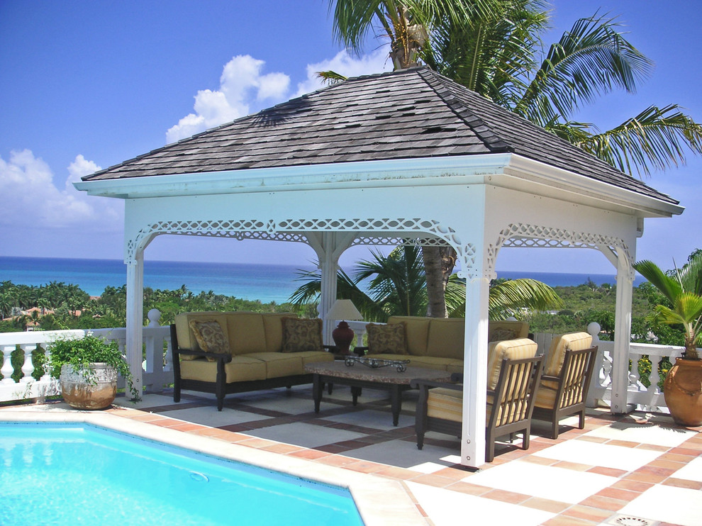 Example of an island style patio design in Other