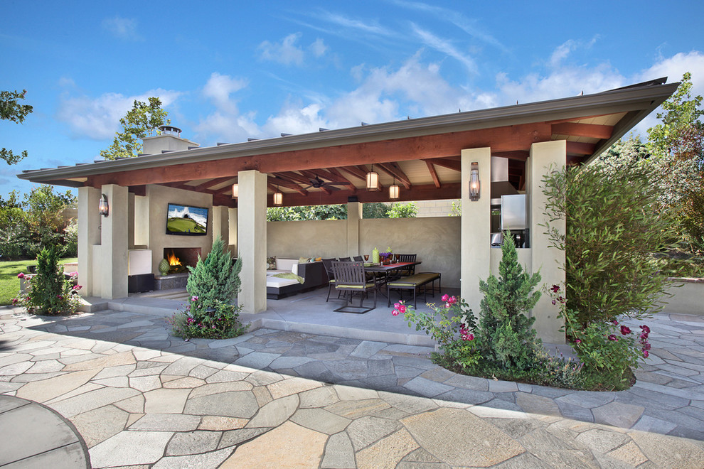 Photo of a contemporary patio in Orange County with a gazebo and a fire feature.