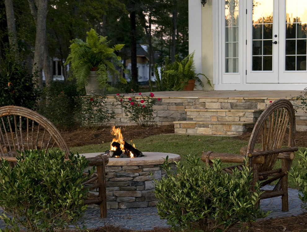 Inspiration for a mediterranean patio in Raleigh with a fire feature.