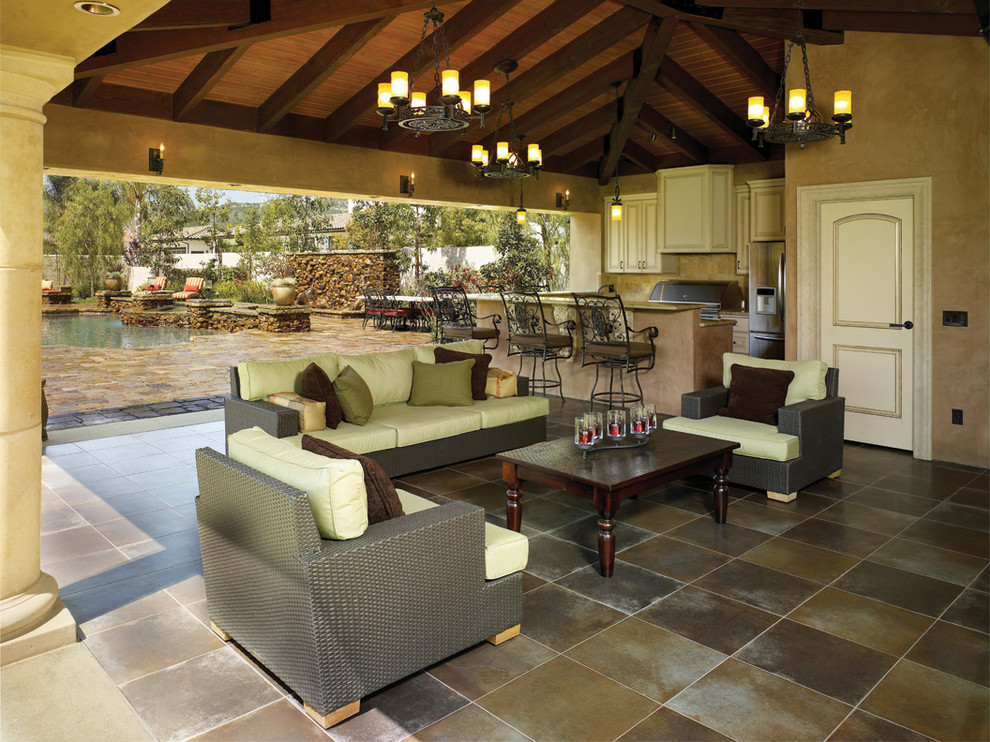 Example of a tuscan patio design in Los Angeles with a gazebo