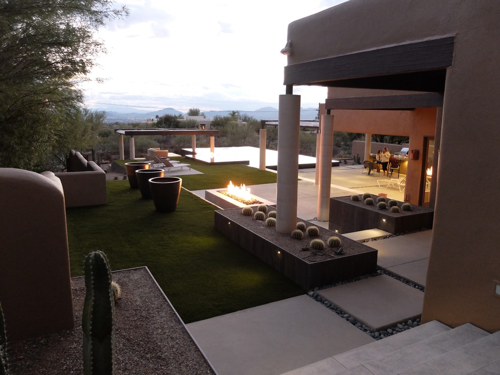 Design ideas for a large contemporary back patio in Phoenix with a fire feature, concrete paving and a gazebo.