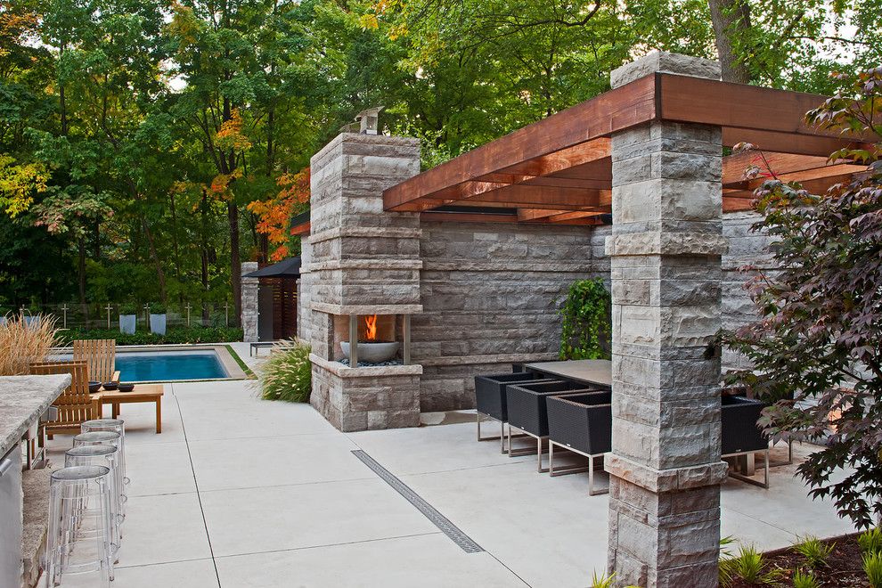 Photo of a contemporary patio in Toronto with a fire feature.