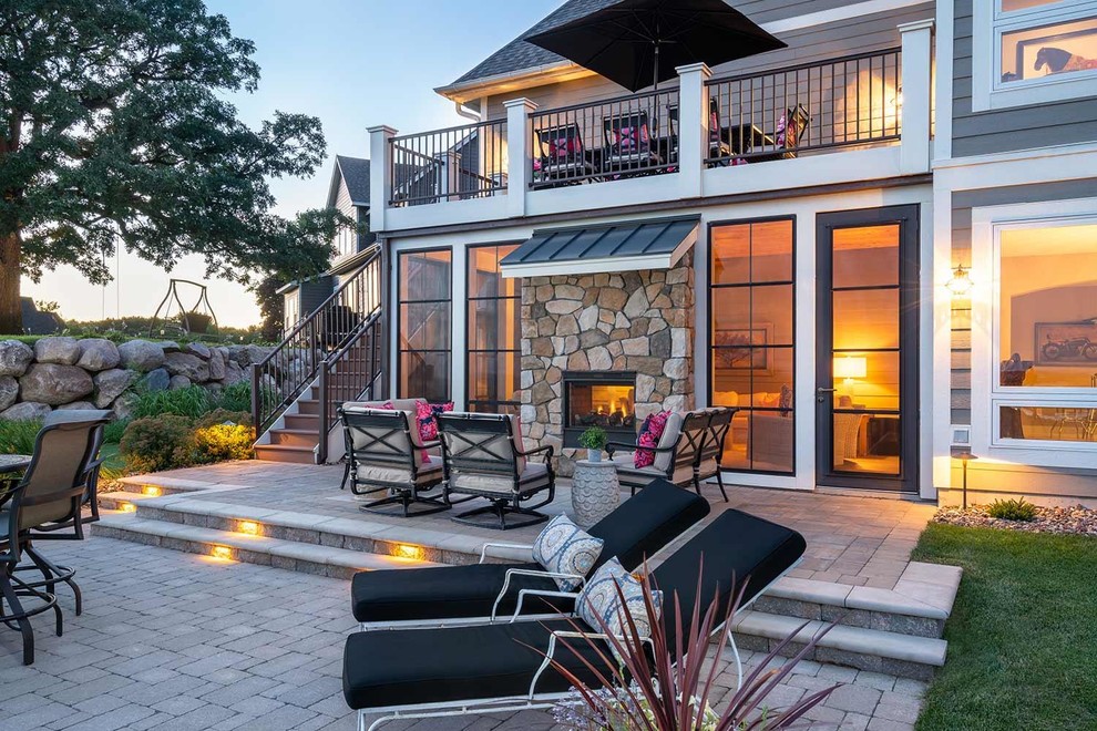 WalkOut Patio with TwoWay Fireplace Patios Transitional Patio