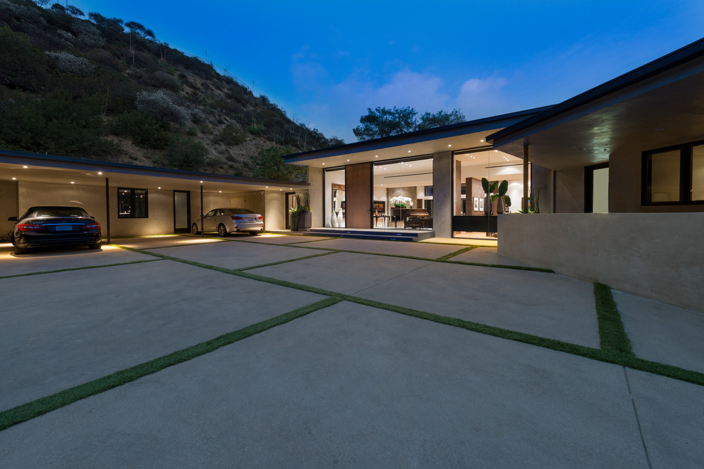 Inspiration for a huge modern attached three-car carport remodel in Los Angeles