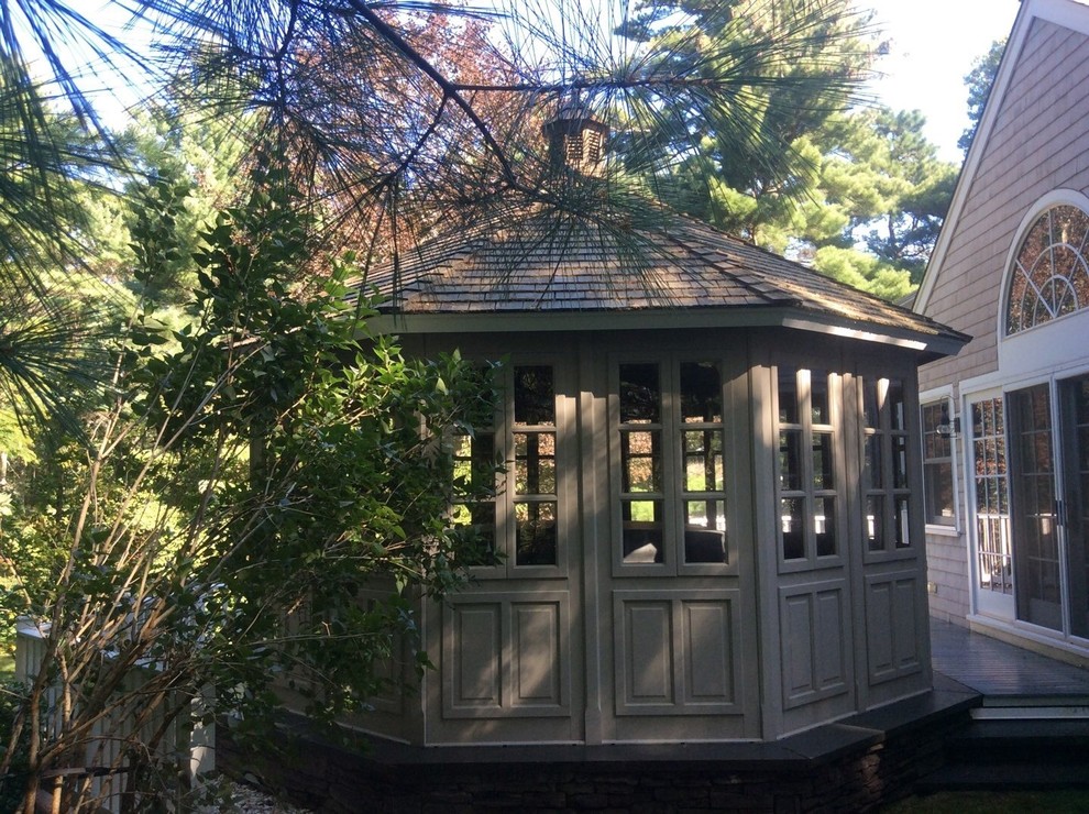 Photo of a medium sized traditional back patio in Boston with decking and a gazebo.