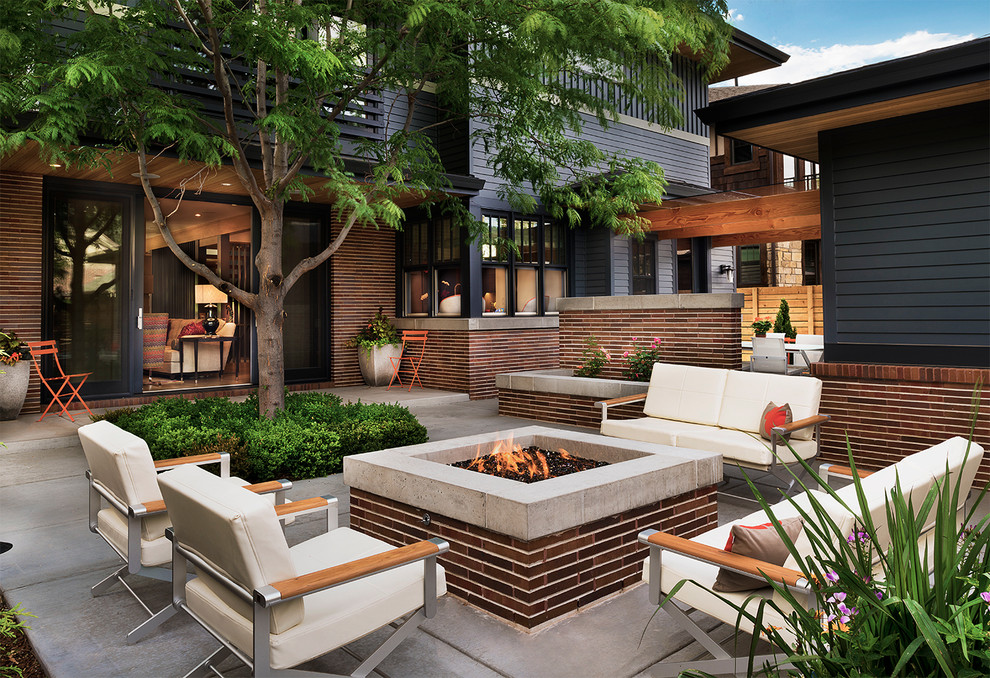 Contemporary patio in Denver with a fire feature and no cover.