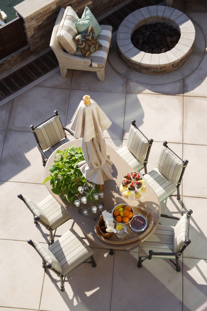 Patio - large coastal concrete paver patio idea in Orange County with no cover and a fire pit