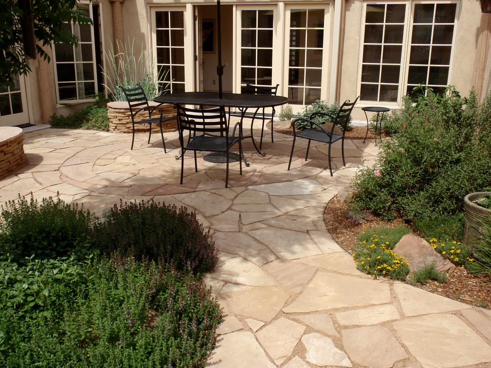 Trendy stone patio photo in Albuquerque