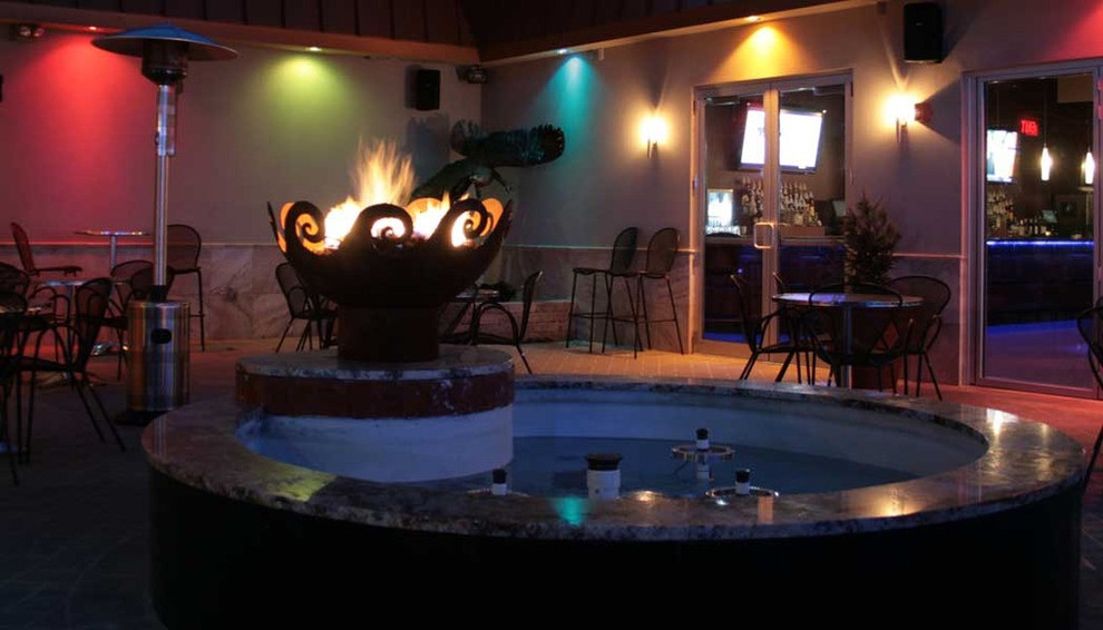 This is an example of a modern patio in Grand Rapids with a fire feature.