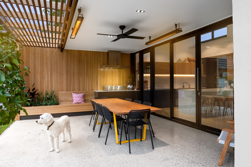Patio - contemporary concrete patio idea in Adelaide with a pergola
