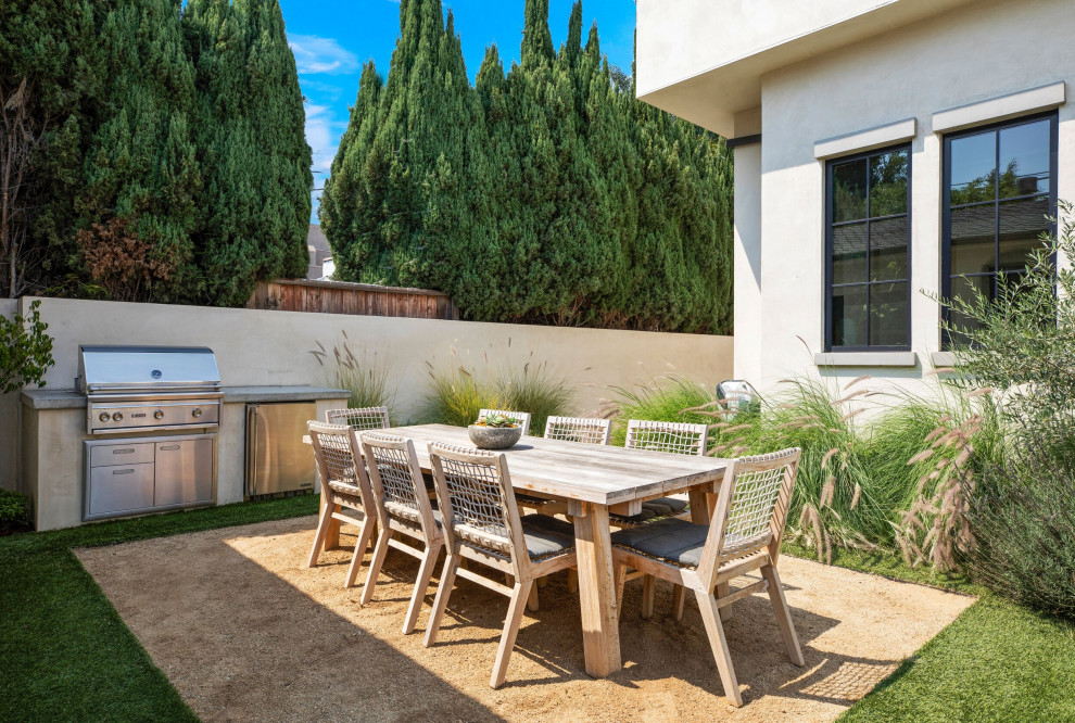 Inspiration for a large transitional courtyard patio kitchen remodel in Los Angeles with no cover