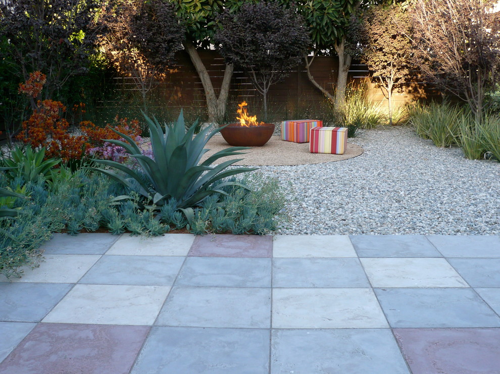 Inspiration for a contemporary backyard concrete paver patio remodel in Los Angeles with a fire pit