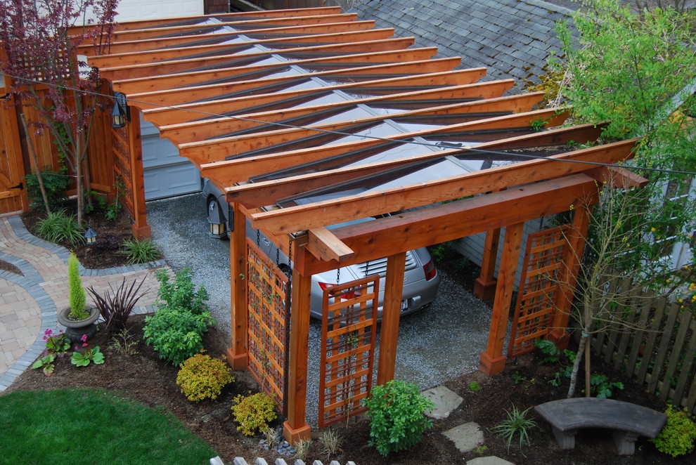 Example of a large classic side yard patio design in Seattle with a pergola