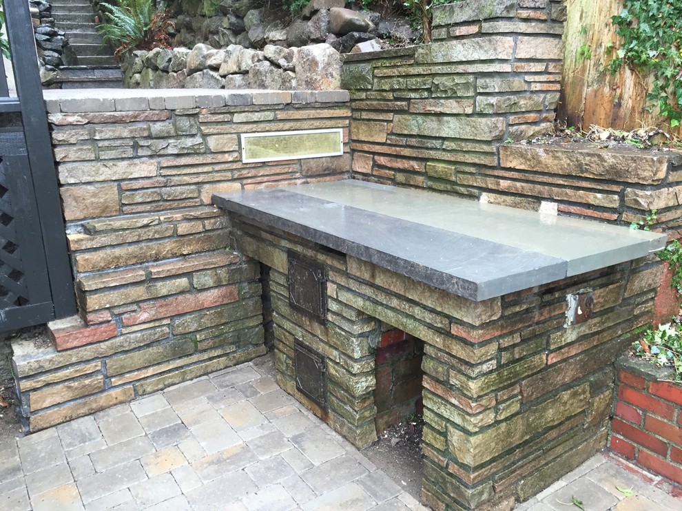 This is an example of a medium sized classic back patio in Seattle.