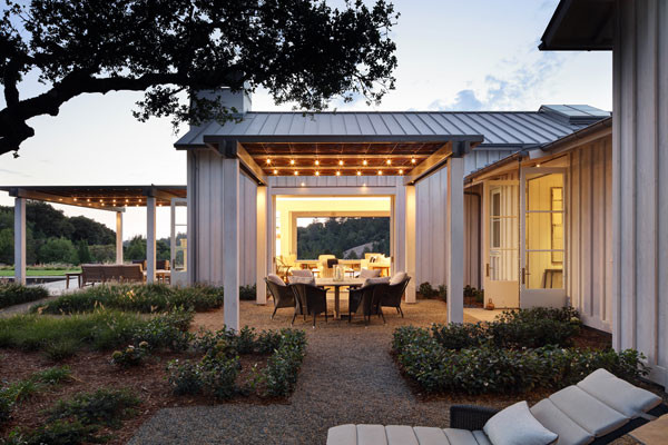 Inspiration for a huge country backyard gravel patio remodel in San Francisco with a fire pit and a pergola