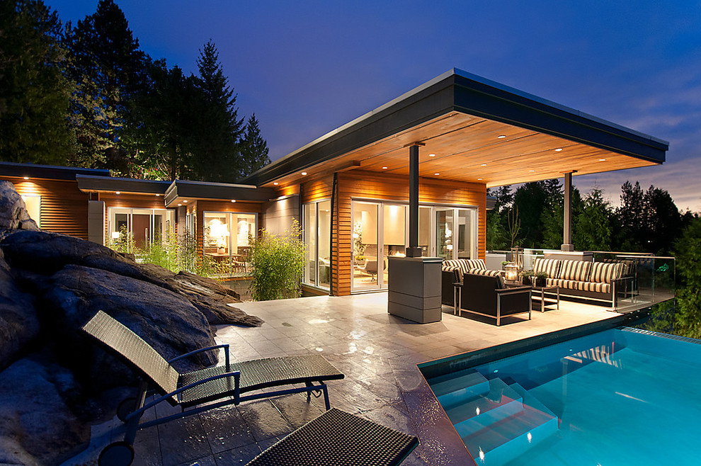 Photo of a contemporary patio in Vancouver with a water feature.