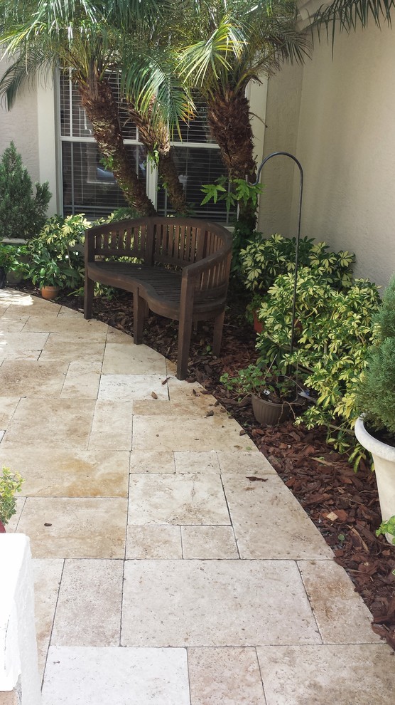 Example of a tuscan patio design in Tampa