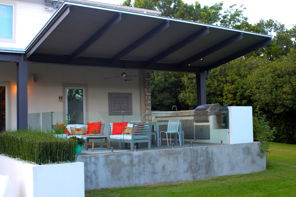 Large modern back patio in Austin with concrete slabs and a gazebo.