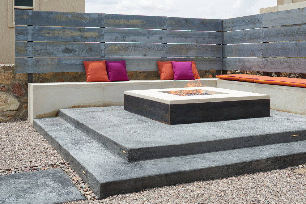 Patio - small contemporary backyard concrete patio idea in Other with a fire pit and no cover