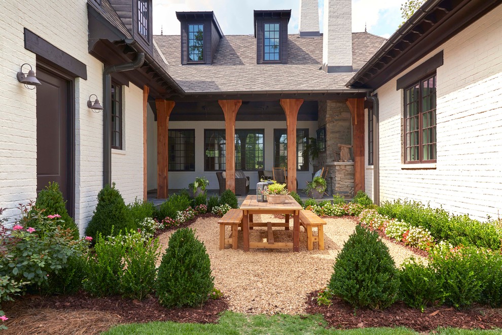 Patio - mid-sized craftsman courtyard gravel patio idea in Birmingham with no cover