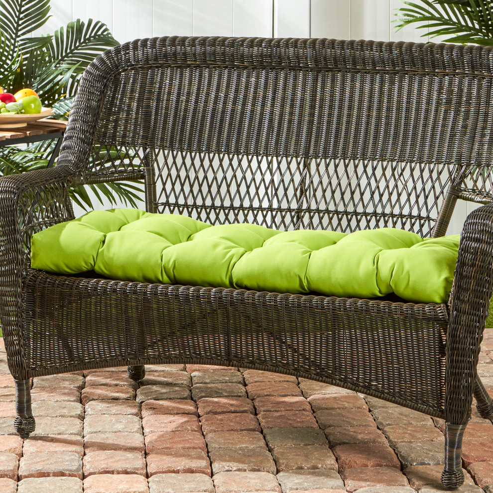 Wicker Loveseat with a Bright Green Cushion - Tropical - Patio