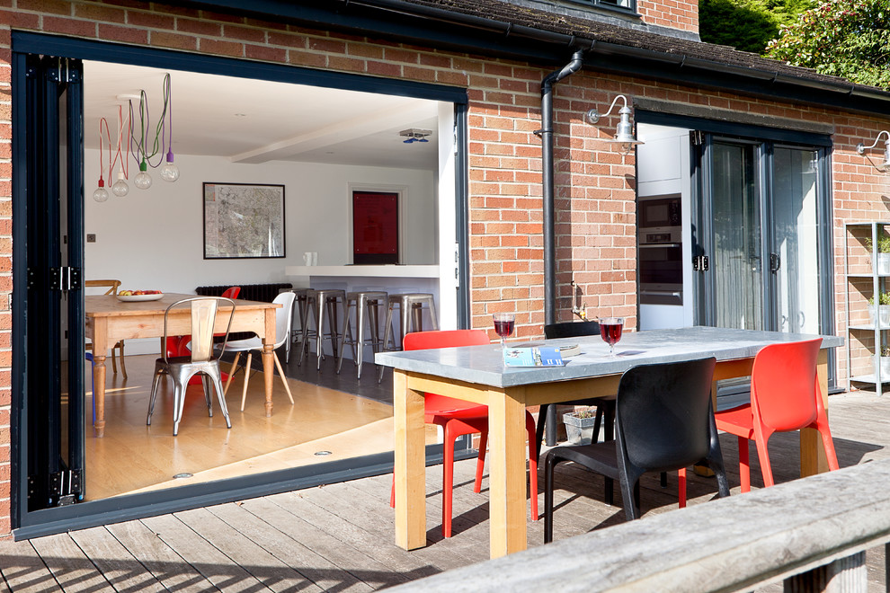 Inspiration for a contemporary patio in London with decking and no cover.