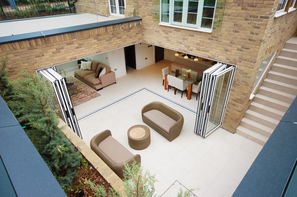 This is an example of a contemporary patio steps in Kent.