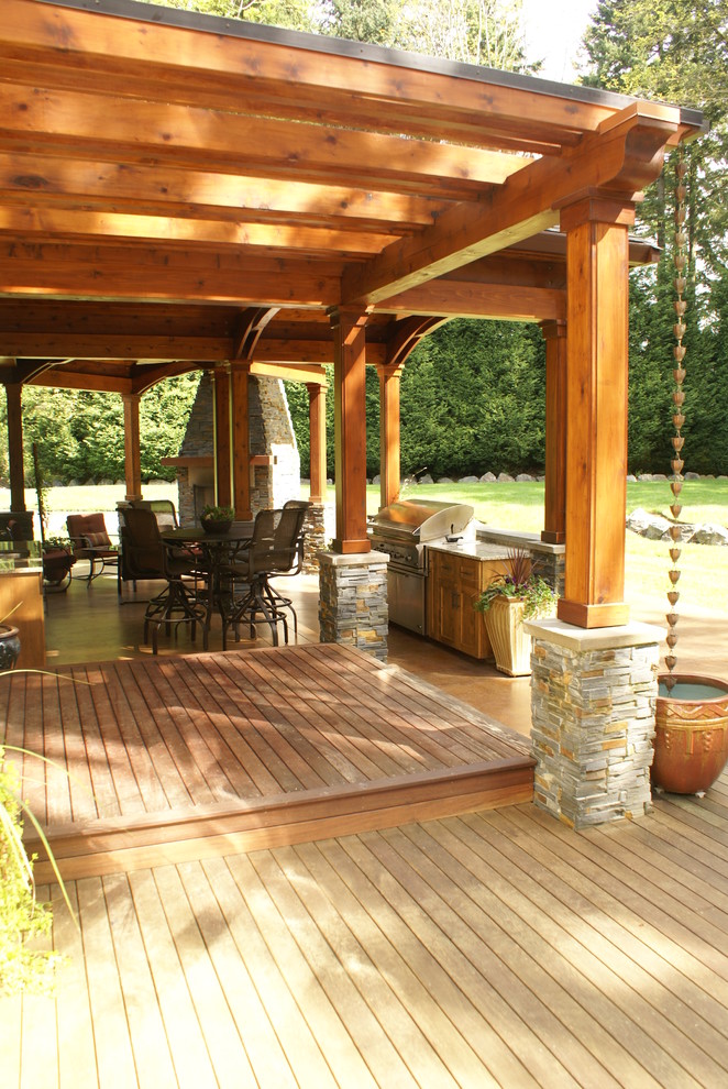 Patio - large craftsman backyard patio idea in Seattle with a fire pit, decking and a pergola