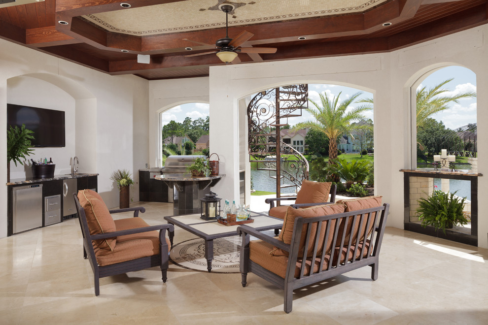 Patio - mediterranean patio idea in Houston with a roof extension