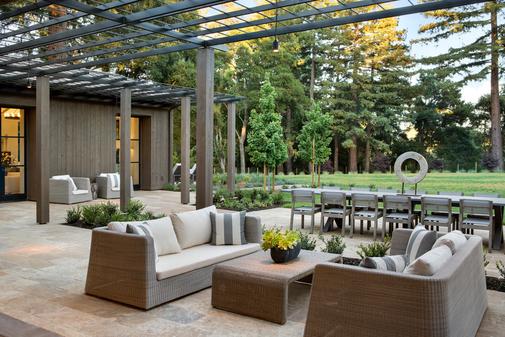 Inspiration for a farmhouse back patio in Los Angeles with a pergola.