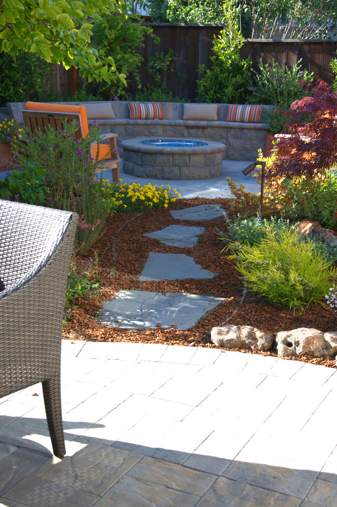 Patio - small transitional backyard concrete paver patio idea in San Francisco with a fire pit and no cover