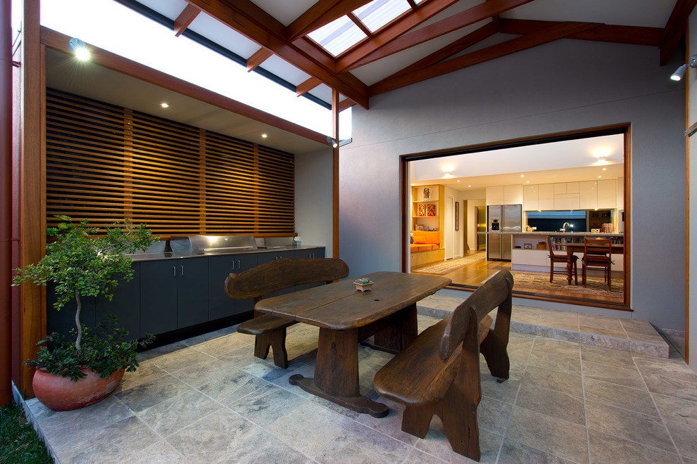 Inspiration for a contemporary patio in Sydney with a roof extension and a bbq area.