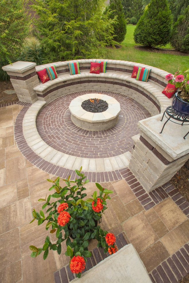 Inspiration for a mid-sized timeless backyard concrete paver patio remodel in Indianapolis with a fire pit