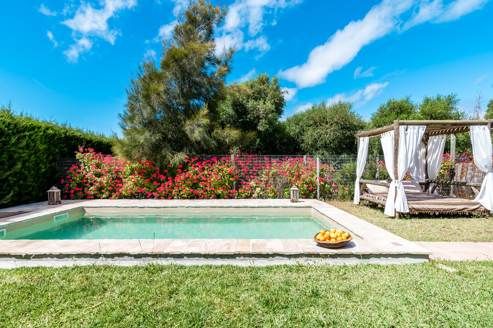 This is an example of a mediterranean rectangular swimming pool in Other.