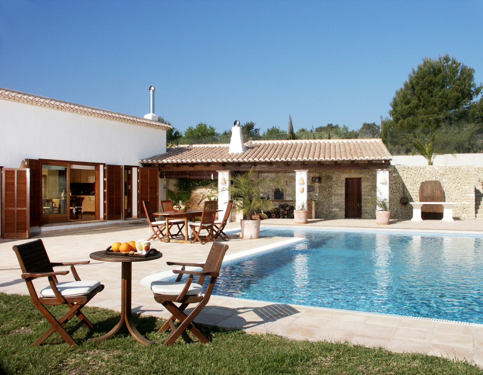 Pool - large mediterranean backyard stone and rectangular pool idea in Alicante-Costa Blanca