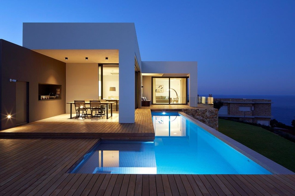 Design ideas for a small modern front l-shaped lengths swimming pool in Other with a pool house.