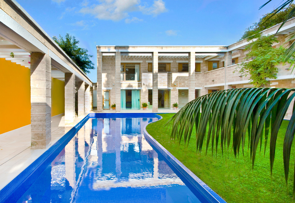 Pool house - large eclectic courtyard lap pool house idea in Palma de Mallorca